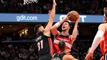 Wizards beat Heat 103-100 to split home-and-home series