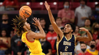 No. 21 Maryland uses strong 2nd half to rally past GW 71-64