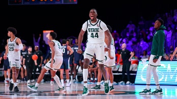 Brown, Spartans pull away late to beat No. 22 UConn 64-60