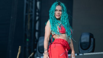 Karol G takes nasty fall down stairs during sold-out concert in Miami