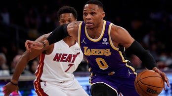 Lakers rally late in regulation, hold off Heat 120-117 in OT
