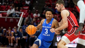 Lucas scores 18 points to send No. 18 BYU over Utah 75-64