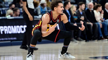 Young leads Hawks past Grizzlies as Morant injures left knee