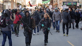 Armed Wisconsin father, daughter say they're protecting Rittenhouse protesters
