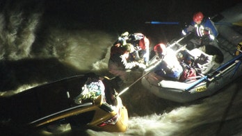 Washington woman, dog rescued from roof of car swept away in river