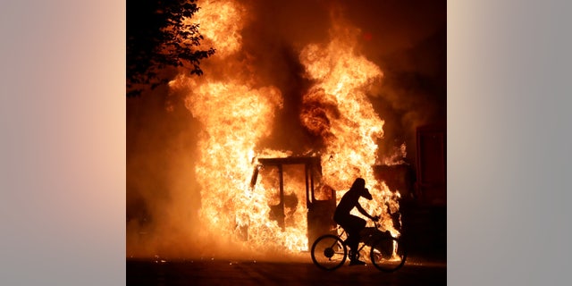 A city truck is on fire outside the Kenosha County Courthouse in Kenosha, Wisconsin, U.S., during riots on August 23, 2020 following the police shooting of Jacob Blake Mike De Sisti/Milwaukee Journal Sentinel via USA TODAY via REUTERS 