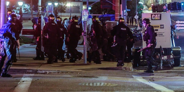 Members of the St. Louis Police Department detain Luther Hall, who later was identified as an undercover police officer, during racial injustice protests in St. Louis, Missouri, U.S., September 17, 2017. Former officer Dustin Boone was sentenced to just over a year in prison Monday for his role in the beating of Hall by fellow officers. 