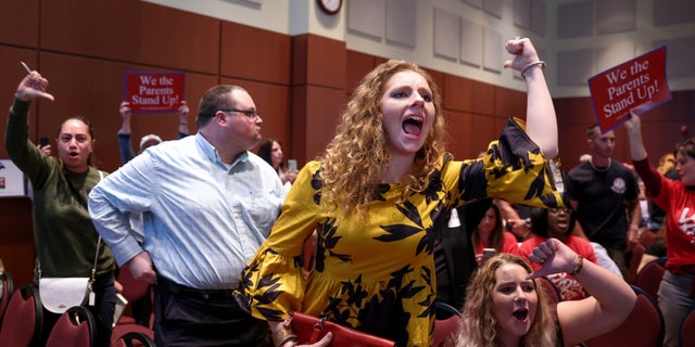 Angry parents and community members protest after a Loudoun County School Board meeting was halted by the school board because the crowd refused to quiet down, in Ashburn, Virginia, U.S.  June 22, 2021.