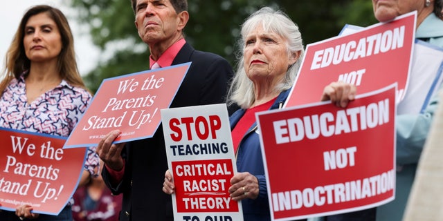 Opponents of critical race theory protest outside the Loudoun County School Board headquarters, in Ashburn, Virginia, on June 22, 2021.