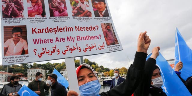 Ethnic Uighur demonstrators take part in a protest against China, in Istanbul, Turkey, October 1, 2021. 
