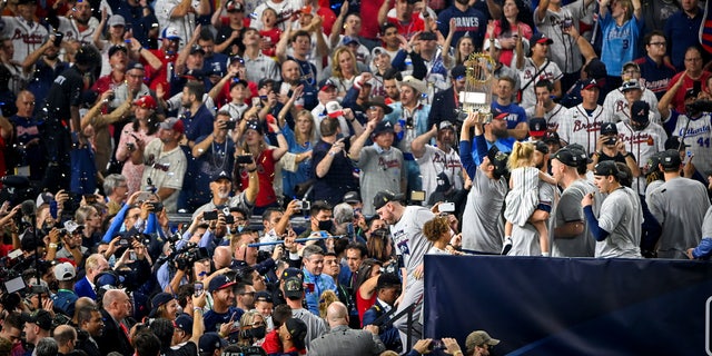Nov 2, 2021; Houston, Texas, USA; The Atlanta Braves celebrate with their fans after defeating the Houston Astros during game six to win the 2021 World Series at Minute Maid Park. Mandatory Credit: Jerome Miron-USA TODAY Sports     TPX IMAGES OF THE DAY