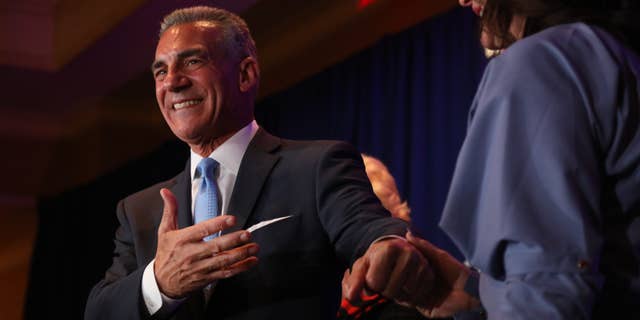 Jack Ciattarelli with his wife Melinda comes out to address his supporters at 12:30am at the Marriott in Bridgewater, NJ on November 3, 2021.