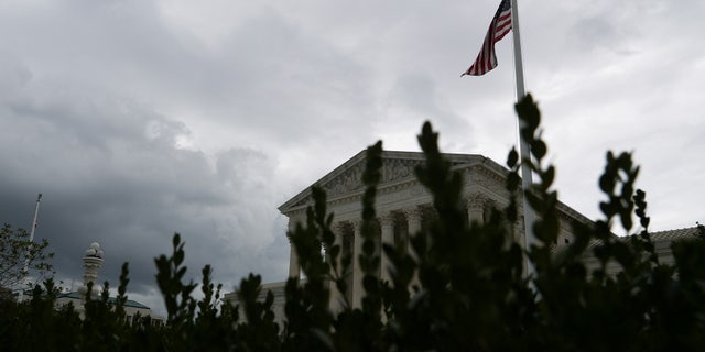 FILE PHOTO: Storm clouds roll in over the U.S. Supreme Court in Washington, U.S., September 1, 2021. REUTERS/Tom Brenner/File Photo