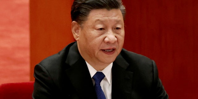 FILE PHOTO: Chinese President Xi Jinping speaks at a meeting commemorating the 110th anniversary of Xinhai Revolution at the Great Hall of the People in Beijing, China October 9, 2021. REUTERS/Carlos Garcia Rawlins/File Photo