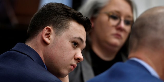 Kyle Rittenhouse listens as his attorney, Mark Richards, give his closing argument during  Rittenhouse's trial at the Kenosha County Courthouse, in Kenosha, Wisconsin, U.S., November 15, 2021. Sean Krajacic/Pool via REUTERS