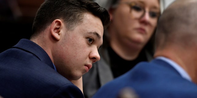 Kyle Rittenhouse listens as his attorney, Mark Richards, give his closing argument during Rittenhouse's trial at the Kenosha County Courthouse, in Kenosha, Wisconsin, U.S., November 15, 2021. Sean Krajacic/Pool via REUTERS