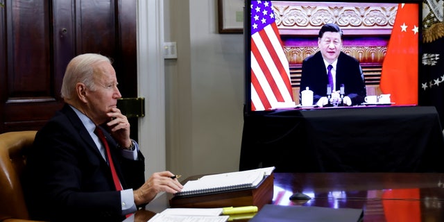 FILE PHOTO: U.S. President Joe Biden speaks virtually with Chinese leader Xi Jinping from the White House in Washington, U.S. November 15, 2021.