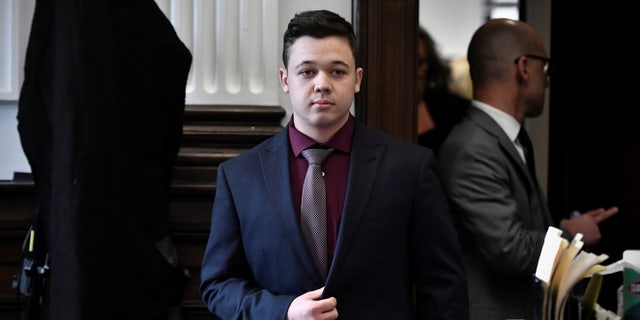 Kyle Rittenhouse walks during his trial at the Kenosha County Courthouse in Kenosha, Wisconsin, U.S., November 19, 2021.  Sean Krajacic/Pool via REUTERS