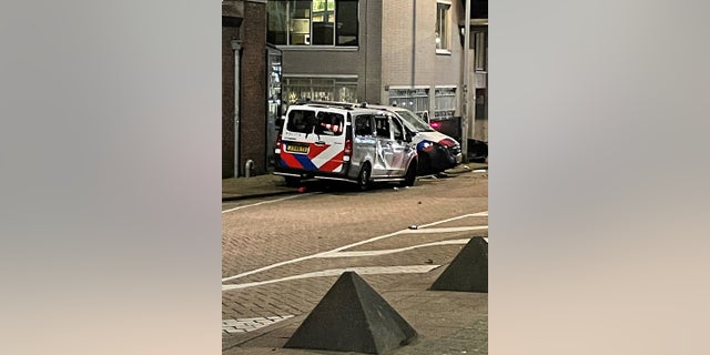 Damaged police vehicles are seen as protests against coronavirus disease (COVID-19) measures turned violent in Rotterdam, Netherlands, November 19, 2021, in this picture obtained from social media. (REUTERS) 