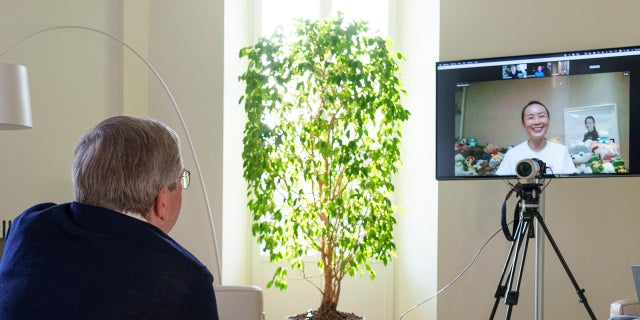 IOC President Thomas Bach speaks with Chinese tennis player Peng Shuai via video call on Sunday, Nov. 21, 2021.