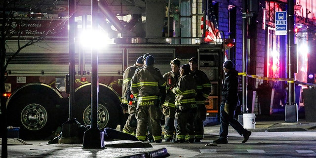 Emergency responders gather after a vehicle plowed through the Christmas Parade, leaving multiple people injured in Waukesha, Wisconsin, Nov. 21, 2021. (Reuters)