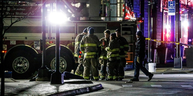 Emergency responders gather after a vehicle plowed through the Christmas Parade, leaving multiple people injured in Waukesha, Wisconsin, Nov. 21, 2021. (Reuters)