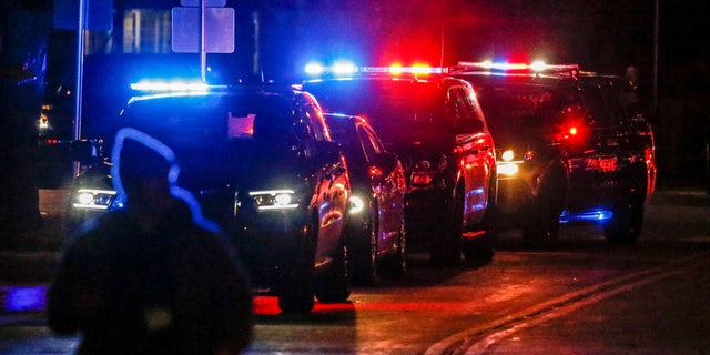 Police and emergency responders gather after a vehicle plowed through the Christmas Parade, leaving multiple people injured in Waukesha, Wisconsin, U.S. November 21, 2021. Scott Ash-USA Today Network via Reuters