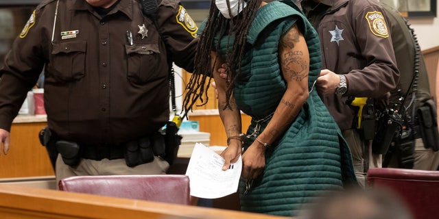 Darrell Brooks, charged with killing five people and injuring nearly 50 after plowing through a Christmas parade with his sport utility vehicle on November 21, appears in Waukesha County Court in Waukesha, Wisconsin, U.S.  November 23, 2021. Mark Hoffman/Pool via REUTERS