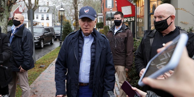 US President Joe Biden speaks to the media before entering 