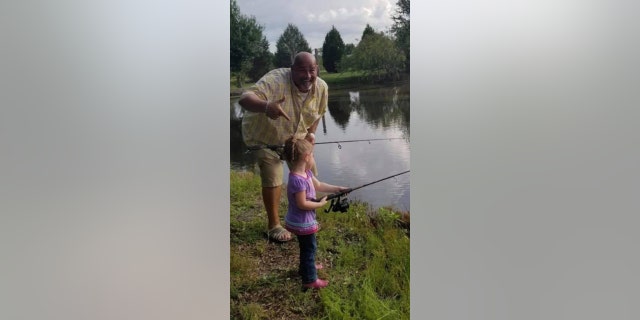 Take a Kid Fishing Inc. CEO William Dunn fishing with a child.