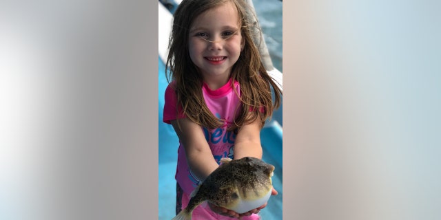 A child fishing with William Dunn's nonprofit, Take a Kid Fishing Inc.