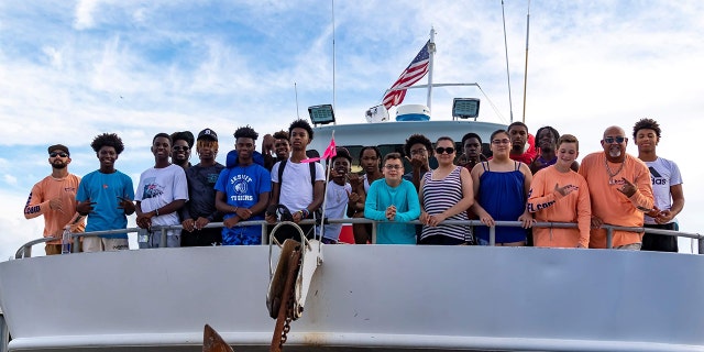 William Dunn taking kids fishing in Clearwater, Florida.
