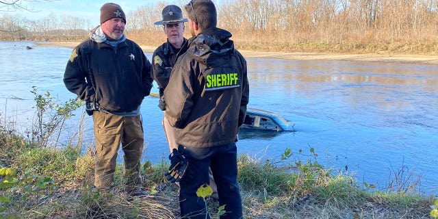Law enforcement officers in Indiana in November along the White River.