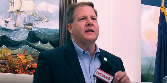 Republican Gov. Chris Sununu announces that he is seeking a fourth term as governor of New Hampshire, instead of running for the U.S. Senate seat held by Democratic Sen. Maggie Hassan, during a news conference, Tuesday, Nov. 9, 2021, in Concord, New Hampshire. (AP Photo/Holly Ramer)