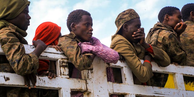 Captured Ethiopian government soldiers and allied militia members are paraded by Tigray forces through the streets in open-top trucks, as they arrived to be taken to a detention center in Mekele, the capital of the Tigray region of northern Ethiopia Friday, Oct. 22, 2021. 