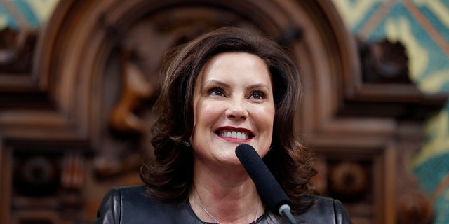FILE - In this Jan. 29, 2020, file photo, Michigan Gov. Gretchen Whitmer delivers her State of the State address to a joint session of the House and Senate, at the state Capitol in Lansing, Mich. (AP Photo/Al Goldis, File)
