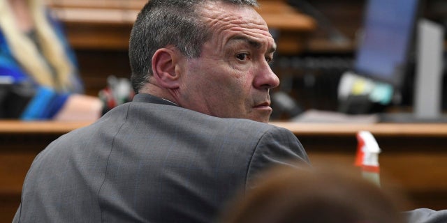Defense Attorney Mark Richards looks around the courtroom at the start of jury selection on the first day of trial for Kyle Rittenhouse