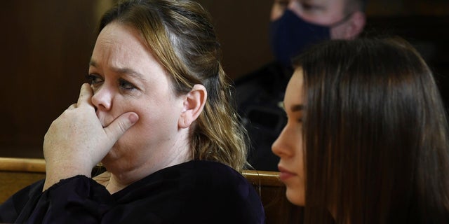 From left, Kyle Rittenhouse's mother, Wendy Rittenhouse, left, listens as the charges against Kyle are read at the start of jury selection in Kenosha, Wis., Circuit Court, Monday Nov. 1, 2021.  (Mark Hertzberg/Pool Photo via AP)