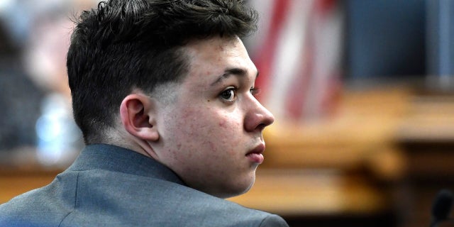 Kyle Rittenhouse looks back at the potential juror pool during the jury selection process at the Kenosha County Courthouse in Kenosha, Wis., Monday, Nov. 1, 2021. Rittenhouse is accused of killing two people and wounding a third during a protest over police brutality in Kenosha, last year. (Sean Krajacic/The Kenosha News via AP, Pool)