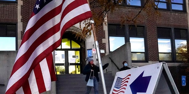 Voters emerge from Sabathani Community Center after casting their ballots during municipal elections Tuesday, Nov. 2, 2021, in Minneapolis.   