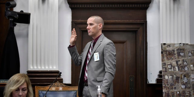 Kenosha Police Department Detective Martin Howard swears in before giving testimony at Kyle Rittenhouse's trial at the Kenosha County Courthouse in Kenosha, Wis., on Wednesday, Nov. 3, 2021. (Sean Krajacic/The Kenosha News via AP, Pool)