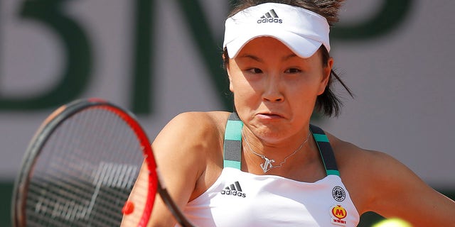 FILE: China's Shuai Peng plays a shot against Romania's Sorana Cirstea during their first round match of the French Open tennis tournament at the Roland Garros stadium, in Paris, France. Tuesday, May 30, 2017. 