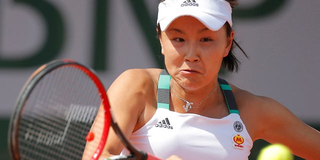 FILE: China's Shuai Peng plays a shot against Romania's Sorana Cirstea during their first round match of the French Open tennis tournament at the Roland Garros stadium, in Paris, France. Tuesday, May 30, 2017.
