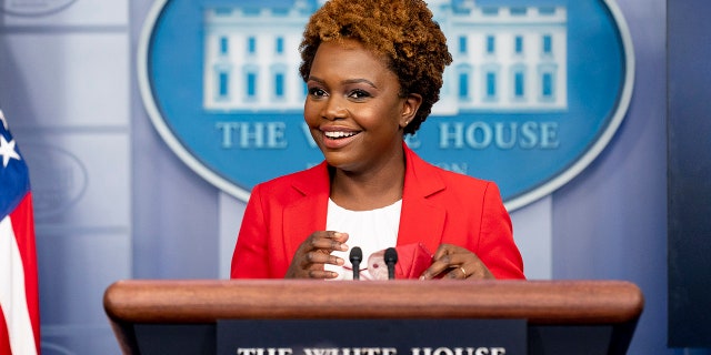 White House deputy press secretary Karine Jean-Pierre smiles as she arrives for a press briefing at the White House in Washington, Thursday, Nov. 4, 2021. (AP Photo/Andrew Harnik)