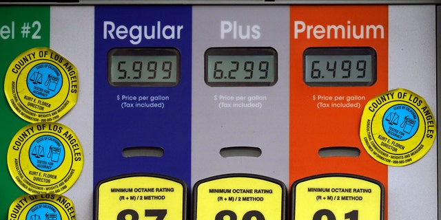 High gas prices are posted at a full service gas station in Beverly Hills, Calif., Sunday, Nov. 7, 2021. (AP Photo/Damian Dovarganes)