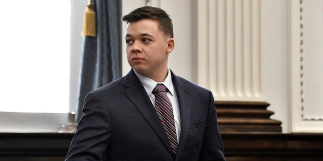 Kyle Rittenhouse looks back to the gallery during a break in testimony from Gaige Grosskreutz during his trial at the Kenosha County Courthouse in Kenosha, Wis., on Monday, Nov. 8, 2021. 