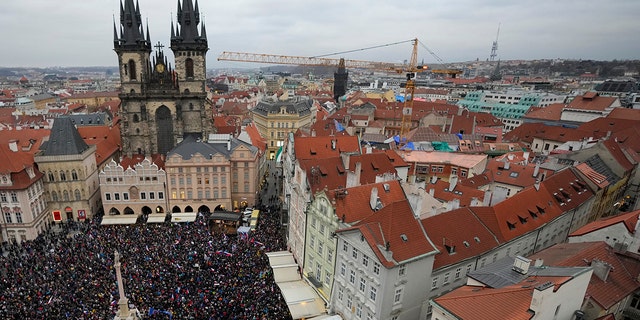Demonstrators gather to protest against the government restriction measures to curb the spread of COVID-19 in Prague, Czech Republic, Wednesday, Nov. 17, 2021. 