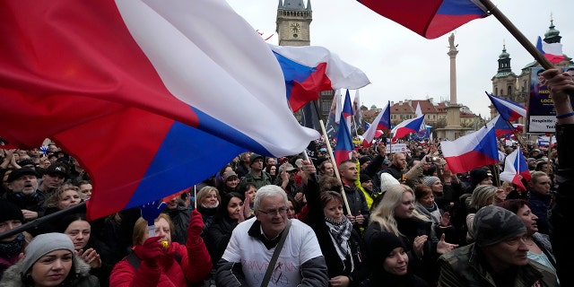 Demonstrators gather to protest against the government restriction measures to curb the spread of COVID-19 in Prague, Czech Republic, Wednesday, Nov. 17, 2021. 