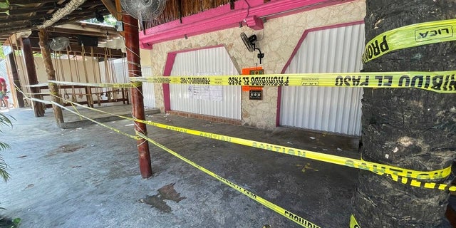 Police security tape covers the exterior of a restaurant the day after a shooting that killed two foreigners and wounded three others caught up in the crossfire between drug dealers in Tulum on Oct. 22. (AP Photo/Christian Rojas, File)