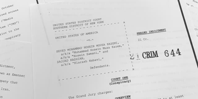 The grand jury indictment against Iranian nationals Seyyed Mohammad Hosein Musa Kazemi and Sajjad Kashian is photographed Thursday, Nov. 18, 2021. The two suspected Iranian computer hackers have been charged with election interference, accused of trying to intimidate American voters ahead of last year's U.S. presidential election by sending threatening messages and spreading disinformation. (AP Photo/Jon Elswick)